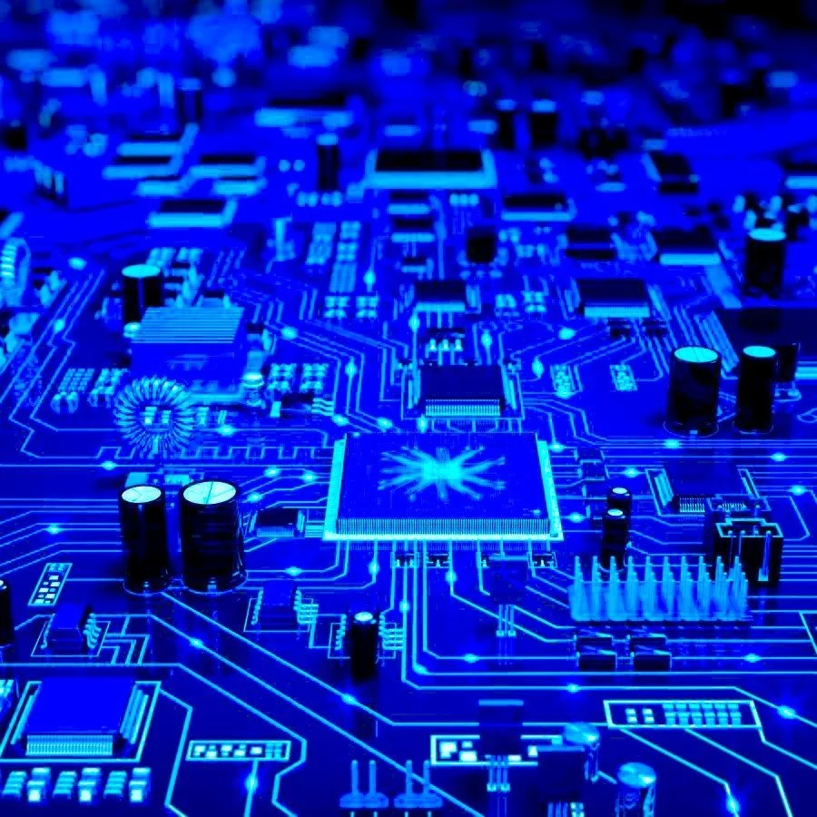 Blue-lit close-up of a circuit board featuring detailed pathways, microchips, and capacitors essential for IT crisis management.